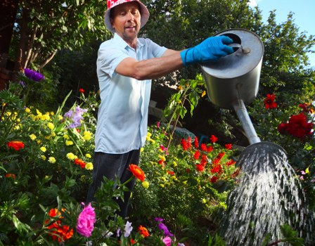 Gardener Notting Hill team working in a vibrant garden